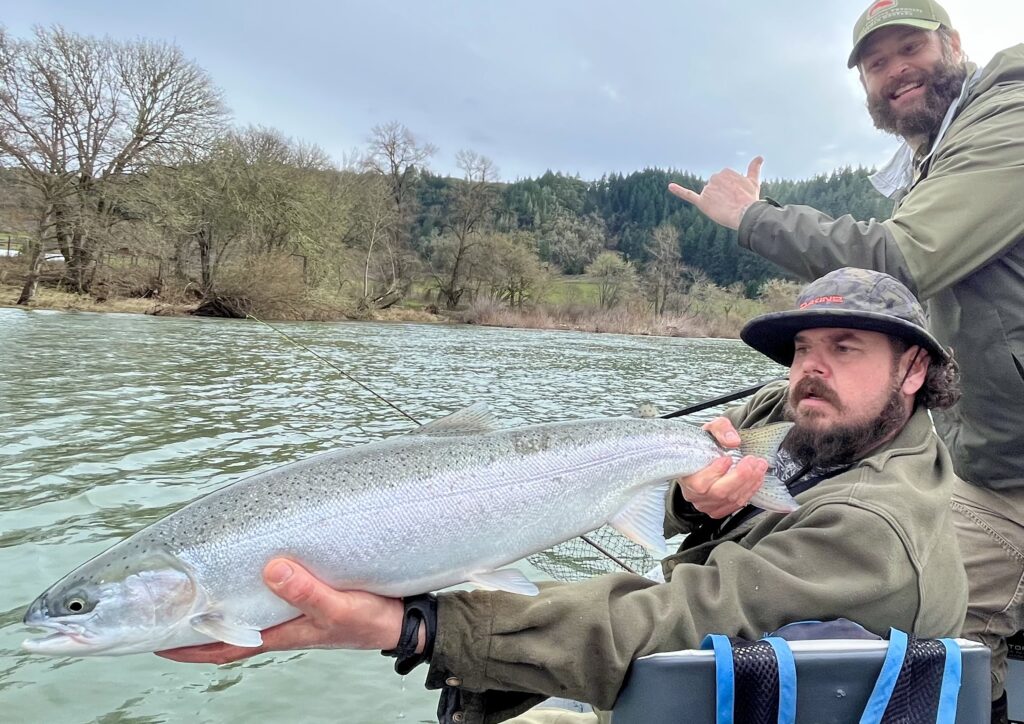 Successful catch during guided Oregon fly fishing experience